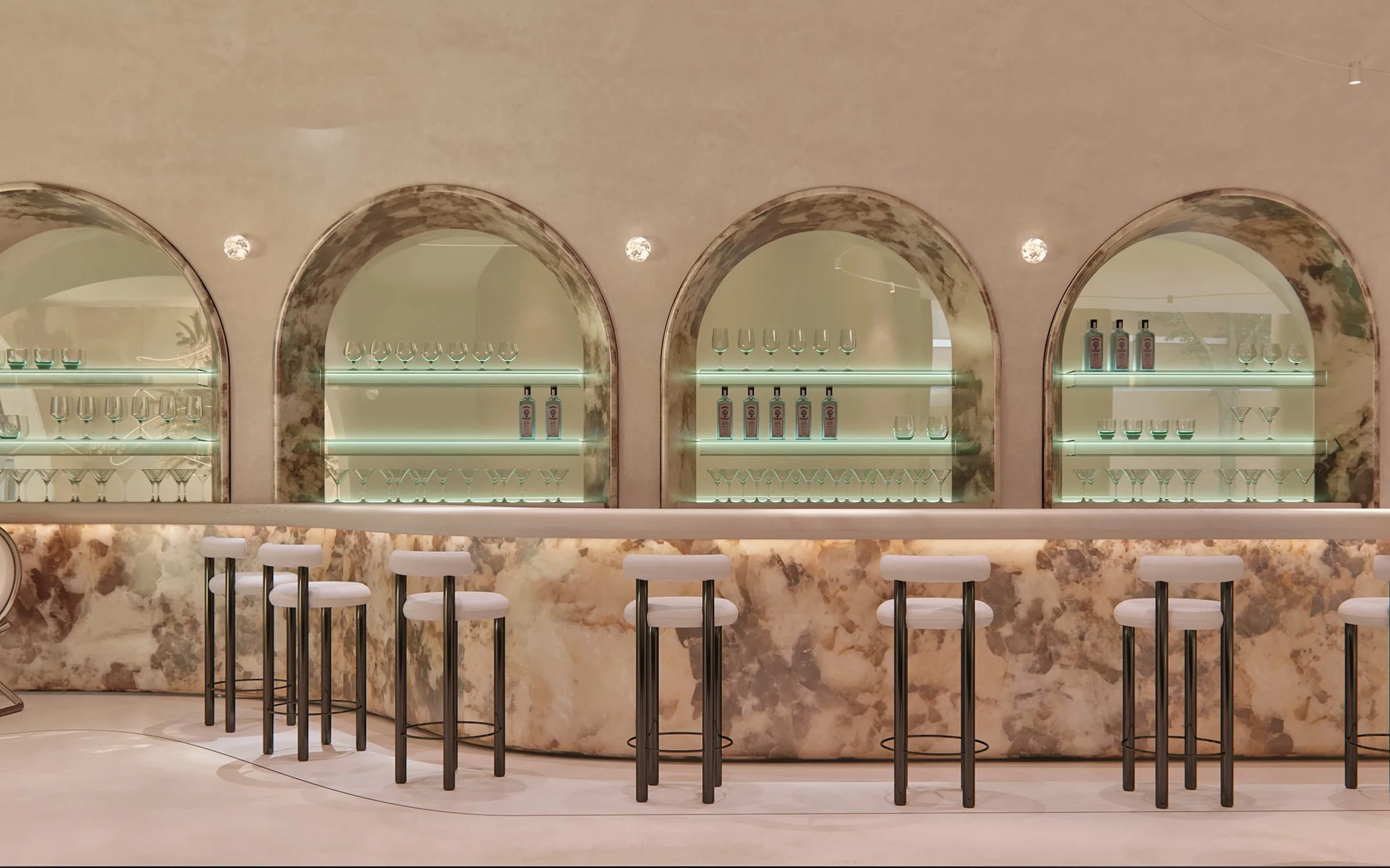 Pastel bar interior with arched niches and backlit glass shelves